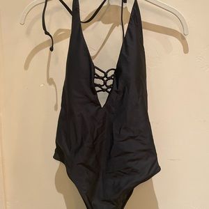 Volcom size S (small) black one piece Worn once! Halter tie neck and logo at hip